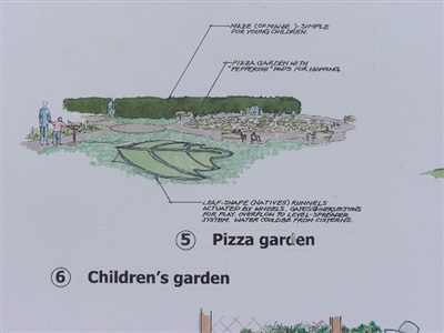 Rendered detail- 

Foreground: Children's interactive water feature. Series of valves allow children to activate water that flows down a naturally occurring slope, flooding large leaf patterns of indigenous trees ultimately ending in agricultural plots. Original source of water was overflow from roof and parking lot. 
Midground: Children's pizza garden where children grow plants that can be used in on-site institutional kitchen. 
Background: The Maize Maze. 