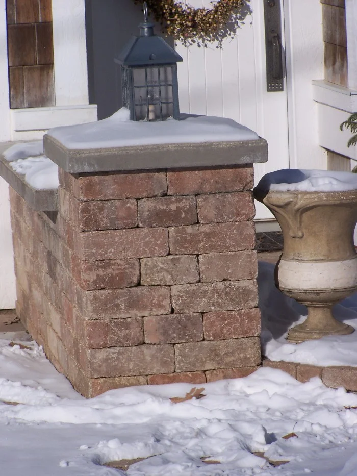 brick column snow covered