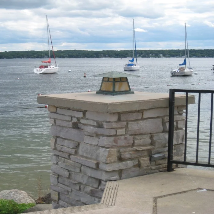 brick column by water
